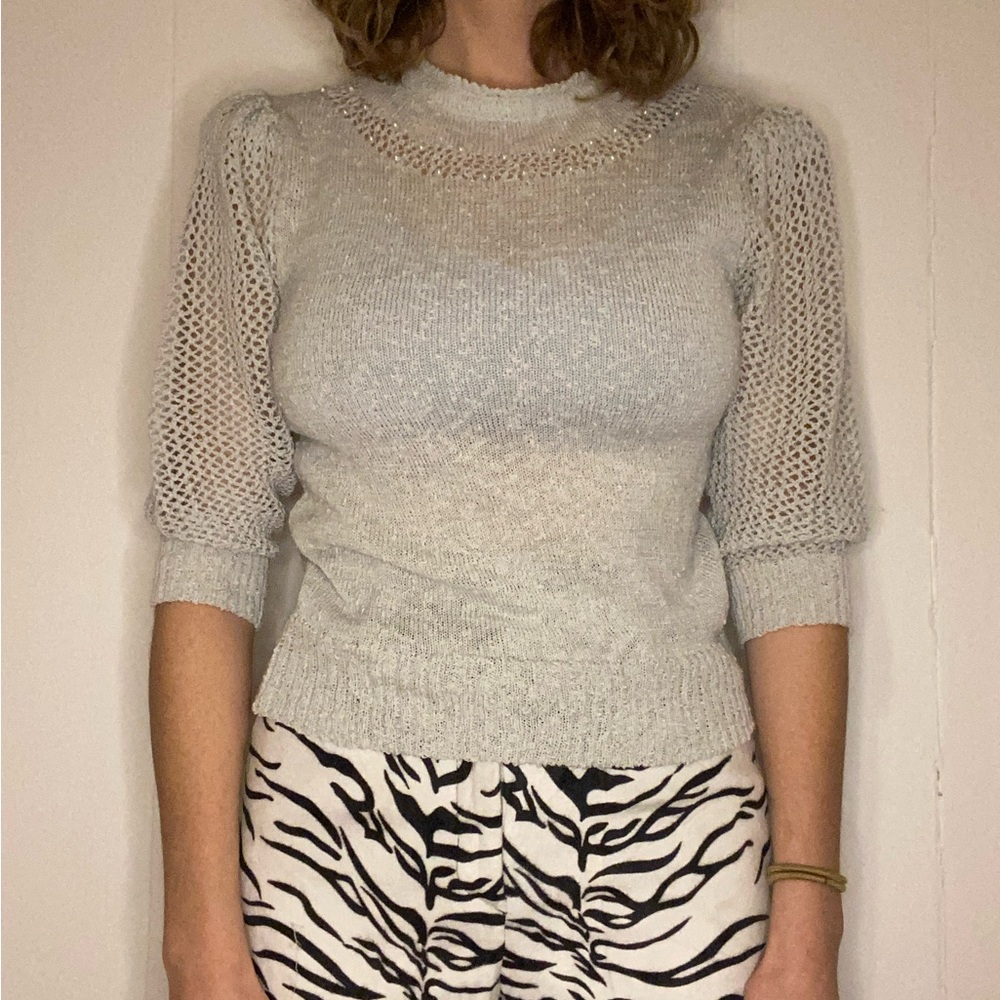 Women’s knit sweater with pearl beads